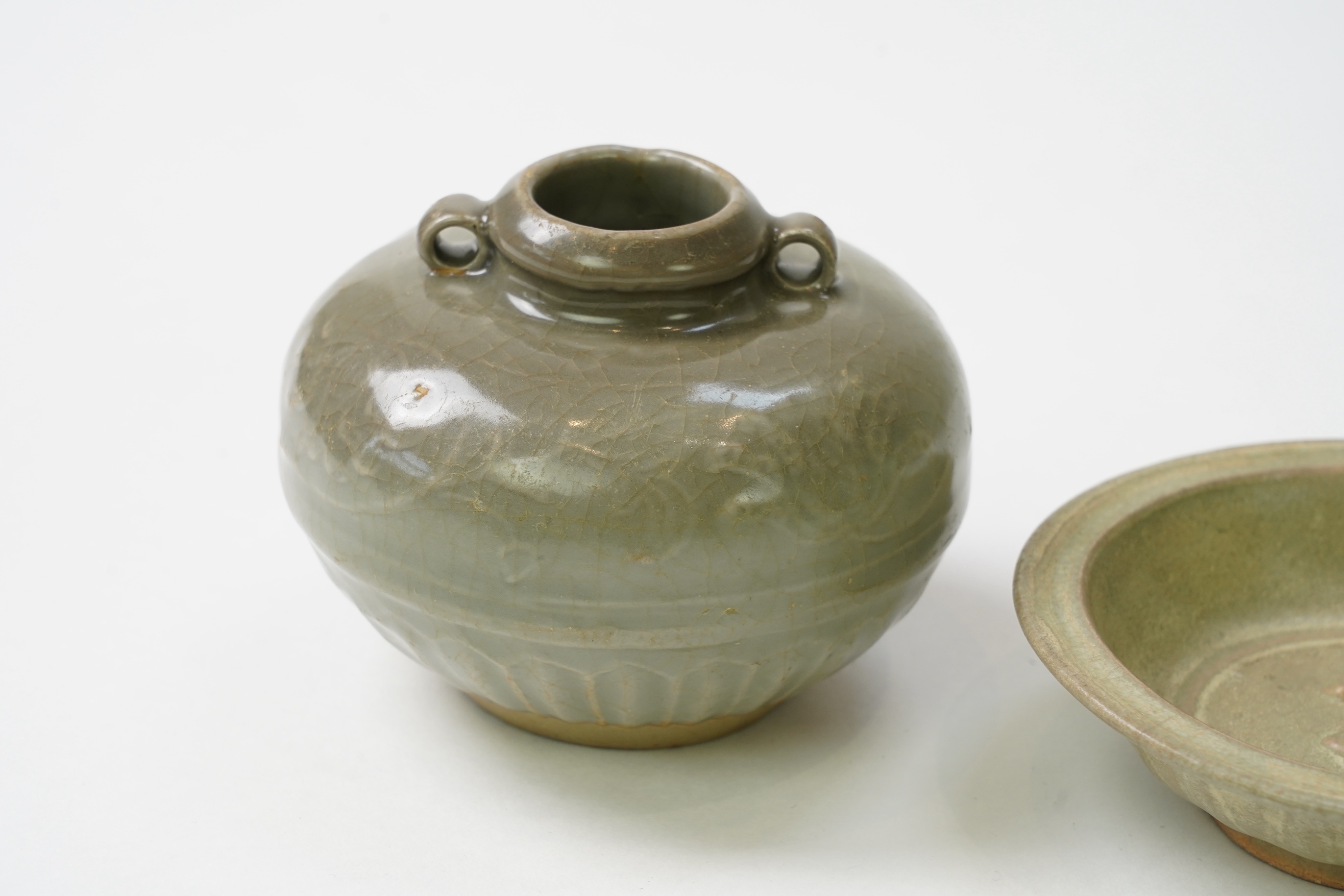 A group of four Chinese Celadon wares - two vases and two dishes, tallest vase 16cm.